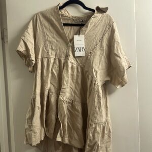 New mini dress that’s cream colored and looking for a good home